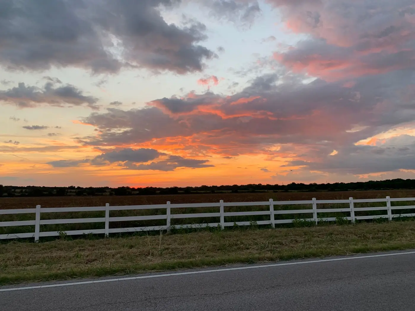 Rural pastureland and ranch fencing outside Wichita Falls, Texas — the kind of septic-served country property we cover